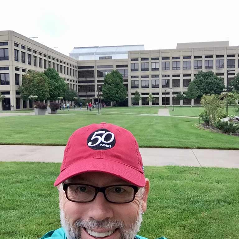 Keith Anliker wears his 50th Anniversary hat outside of the School of Science.