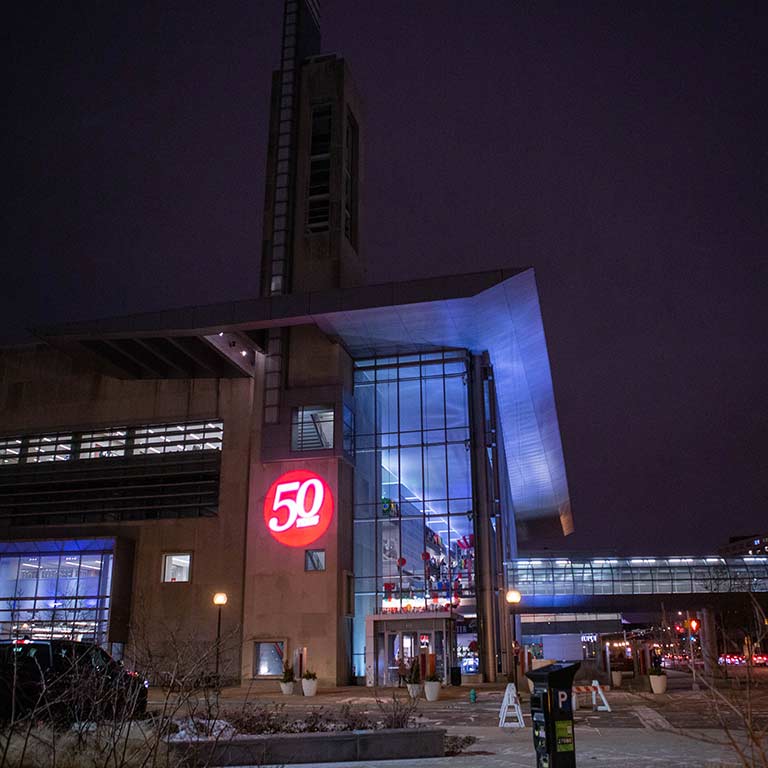 The IUPUI Campus Center lit up at night.