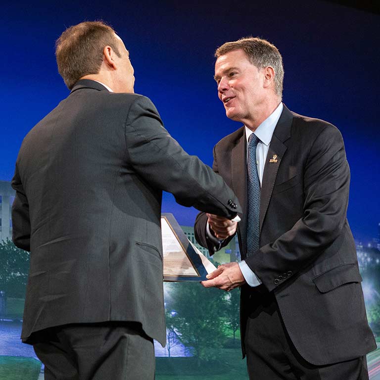 Chancellor Nasser H. Paydar and Indianapolis Mayor Joe Hogsett shake hands at the Report to the Community.
