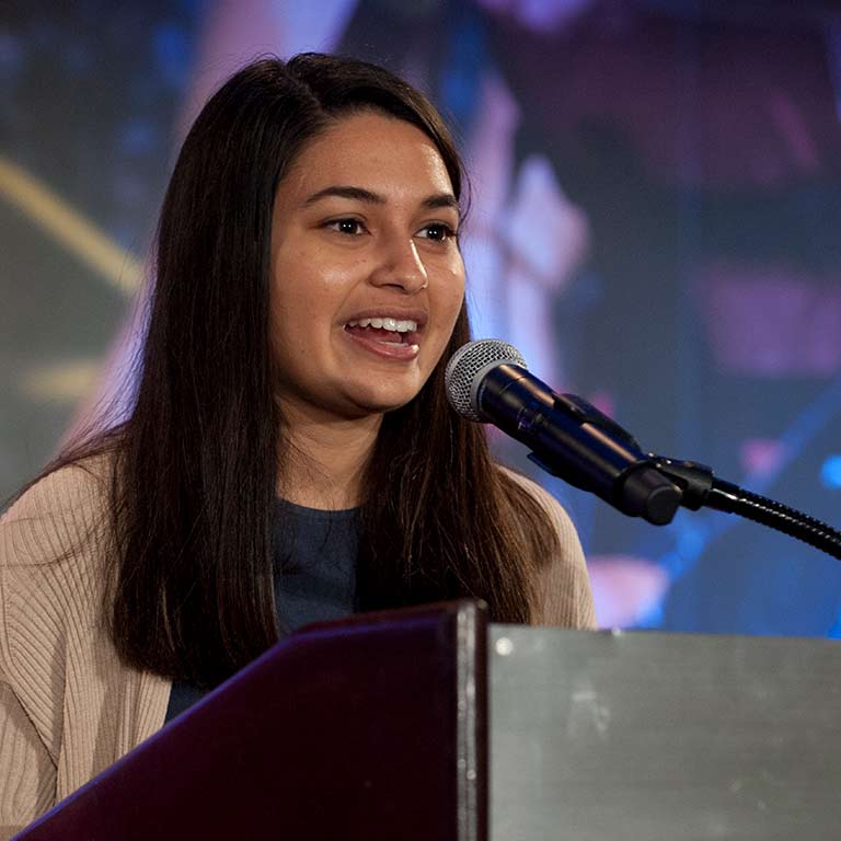 Priya Dave speaks at the podium during the 2018 IUPUI Top 100 celebration.