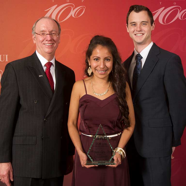 Former IUPUI Chancellor Charles Bantz, Mariana Lopez-Owens, and Most Outstanding Male Student Ben Judge at IUPUI's Top 100 in 2014 when Mariana was named Most Outstanding Female Student.