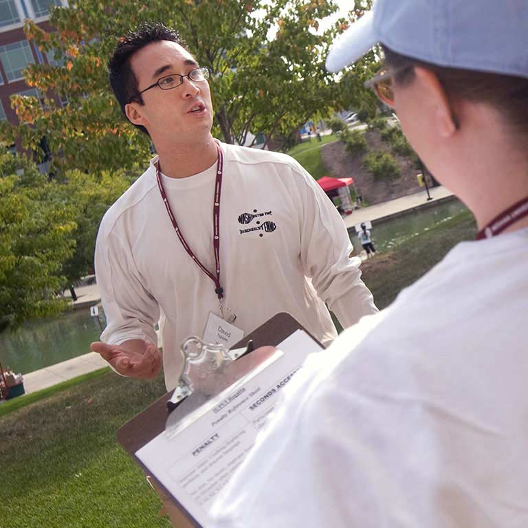 David Nguyen speaks with race judges at the 2009 IUPUI Regatta.