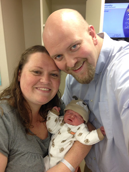 Sean Winningham with his wife and newborn son.